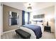 Comfortable bedroom featuring an upholstered bed frame, art and neutral walls at 18134 W Creedance Blvd, Surprise, AZ 85387