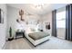 Charming bedroom featuring a unique desert mural, comfortable bed, and stylish decor at 18134 W Creedance Blvd, Surprise, AZ 85387