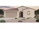 Charming single-story home featuring a well-manicured desert landscape and an attached two-car garage at 18134 W Creedance Blvd, Surprise, AZ 85387