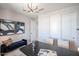 Beautiful home office with a navy couch, accent wall and plenty of storage at 18134 W Creedance Blvd, Surprise, AZ 85387