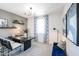 Stylish home office featuring modern décor, accent wall, desk, and comfortable seating area at 18134 W Creedance Blvd, Surprise, AZ 85387