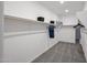 Spacious walk-in closet with custom shelving and ample storage space for organization and style at 18134 W Creedance Blvd, Surprise, AZ 85387