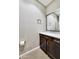 Clean powder room with elegant vanity, stylish fixtures and sleek tile flooring at 18562 N 94Th St, Scottsdale, AZ 85255
