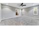 Expansive bedroom with plush carpeting, plantation shutters, and an ensuite bathroom at 18562 N 94Th St, Scottsdale, AZ 85255