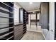 Custom walk-in closet with ample shelving and storage for organizing clothes and accessories at 18562 N 94Th St, Scottsdale, AZ 85255