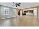 Open-concept living area featuring wood-style flooring, bright windows, and a seamless transition to the kitchen at 18562 N 94Th St, Scottsdale, AZ 85255