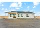 Expansive backyard view of this home, featuring neutral stucco and a covered patio perfect for outdoor relaxation at 18931 W Crescent Way, Buckeye, AZ 85326