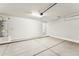 Spacious, clean garage with concrete flooring, ample lighting, and water heater at 18931 W Crescent Way, Buckeye, AZ 85326