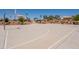 Basketball court offers sports and recreation with multiple hoops, and nearby shaded seating at 20251 W Madison St, Buckeye, AZ 85326
