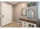 Welcoming entryway with a console table, decorative mirrors, and stylish tile flooring at 20251 W Madison St, Buckeye, AZ 85326