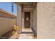 Inviting front porch featuring a dark wood door, cute decorations, and warm welcome at 20251 W Madison St, Buckeye, AZ 85326