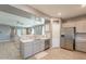Open concept kitchen and living area with modern appliances, neutral tones, and seamless flow at 20251 W Madison St, Buckeye, AZ 85326