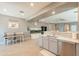 Spacious kitchen area adjacent to living, featuring modern appliances and seamless flow for comfortable living at 20251 W Madison St, Buckeye, AZ 85326