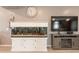 Cozy living room featuring a large aquarium, entertainment center, and stylish decor, creating a relaxing atmosphere at 20251 W Madison St, Buckeye, AZ 85326