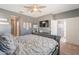 Tranquil main bedroom offering a cozy bed, ceiling fan, and stylish decor, creating a peaceful retreat at 20251 W Madison St, Buckeye, AZ 85326