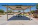 A shady covered picnic area provides a place to relax and enjoy outdoor meals within the community at 20251 W Madison St, Buckeye, AZ 85326