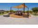 Community playground with shade, slide, and swings for outdoor fun and recreation at 20251 W Madison St, Buckeye, AZ 85326