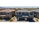 Beautiful view of a new neighborhood showcasing gray and terracotta roofs and spacious garages at 21047 N 58Th Way, Phoenix, AZ 85054