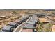 An aerial view showcases a neighborhood with modern homes, well-planned streets, and a mix of landscaping at 21047 N 58Th Way, Phoenix, AZ 85054