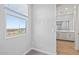 Bright bathroom view showing a large window with desert views and vanity with grey cabinets at 21047 N 58Th Way, Phoenix, AZ 85054