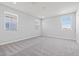 Spacious, carpeted bedroom with multiple windows providing natural light at 21047 N 58Th Way, Phoenix, AZ 85054