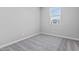 Bedroom featuring neutral walls and carpet, plus natural light from a bright window at 21047 N 58Th Way, Phoenix, AZ 85054