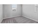Bedroom featuring neutral walls and carpet, plus natural light from a bright window at 21047 N 58Th Way, Phoenix, AZ 85054