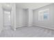 Neutral bedroom with plush carpeting and a bright, sunlit window at 21047 N 58Th Way, Phoenix, AZ 85054