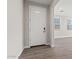 Foyer with tiled floors, white trim and front door, and an open view of the interior at 21047 N 58Th Way, Phoenix, AZ 85054