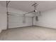 Spacious two-car garage featuring sealed concrete floors and ample lighting at 21047 N 58Th Way, Phoenix, AZ 85054