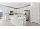 Modern kitchen featuring stainless steel appliances, a center island, and stylish white cabinetry at 21047 N 58Th Way, Phoenix, AZ 85054