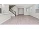 Open-concept living area with tile flooring, staircase, and an open view of the interior at 21047 N 58Th Way, Phoenix, AZ 85054