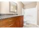 Traditional bathroom features a granite countertop, vanity with storage, mirror, and shower over tub at 2134 E Broadway Rd # 2030, Tempe, AZ 85282