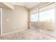 Light-filled bedroom featuring plush carpeting and a sliding glass door to a private balcony at 2134 E Broadway Rd # 2030, Tempe, AZ 85282