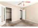Bedroom showcases carpet, neutral paint, and two doors, one to the closet at 2134 E Broadway Rd # 2030, Tempe, AZ 85282