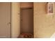 Close-up of a condo front door with a 'hello' doormat and secure entry features at 2134 E Broadway Rd # 2030, Tempe, AZ 85282