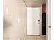 Clean, simple condo entry featuring tile floors and a secure-entry door at 2134 E Broadway Rd # 2030, Tempe, AZ 85282