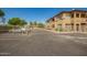 View of the gated community with mature landscaping, security and convenient parking at 2134 E Broadway Rd # 2030, Tempe, AZ 85282