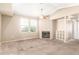 Bright and airy living room with a fireplace and plush carpeting, offering a comfortable retreat at 2134 E Broadway Rd # 2030, Tempe, AZ 85282