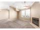 Open-concept living area with a fireplace and ample natural light from large windows at 2134 E Broadway Rd # 2030, Tempe, AZ 85282