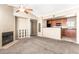 Comfortable living room featuring a fireplace, open to the kitchen for easy entertaining at 2134 E Broadway Rd # 2030, Tempe, AZ 85282