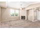 Inviting living room with a cozy fireplace and plush carpet, ideal for relaxing at 2134 E Broadway Rd # 2030, Tempe, AZ 85282