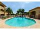 Inviting pool area surrounded by palm trees, offering a refreshing oasis for residents to unwind at 2134 E Broadway Rd # 2030, Tempe, AZ 85282