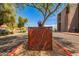 Decorative metal Villa Real sign is set amongst desert landscaping and mature trees at 2134 E Broadway Rd # 2030, Tempe, AZ 85282