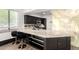 Modern kitchen boasting granite countertops, black cabinetry, and luxury vinyl plank flooring at 21655 N 36Th Ave # 131, Glendale, AZ 85308