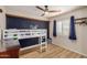 Cozy bedroom with playful decor, laminate flooring, and bright natural light at 2256 S Las Flores --, Mesa, AZ 85202
