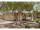 Exterior of tan brick home with covered porch and a swing at 2256 S Las Flores --, Mesa, AZ 85202
