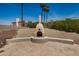 Outdoor fireplace area with a cozy seating space, great for evening relaxation and entertainment at 2256 S Las Flores --, Mesa, AZ 85202
