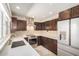 Bright kitchen featuring stainless steel appliances, tile backsplash, and modern cabinets at 2256 S Las Flores --, Mesa, AZ 85202