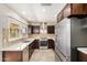 Bright kitchen featuring stainless steel appliances, tile backsplash, and modern cabinets at 2256 S Las Flores --, Mesa, AZ 85202